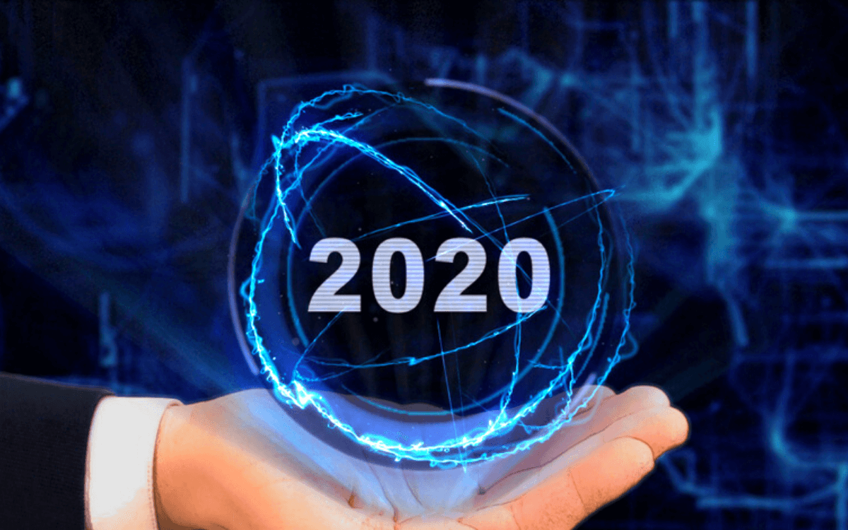 Hand holding a globe with text 2020 for 2020 vision